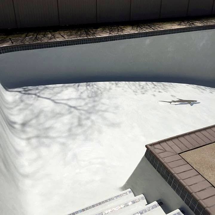 Freshly plastered pool steps with new tile, before the fill